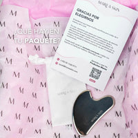 Gua Sha en su caja y con los complementos que incluye la compra